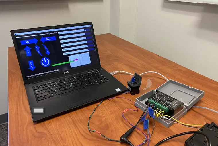 A laptop running the control GUI Drew wrote, wired to an Arduino, microstep drivers and a stepper motor.